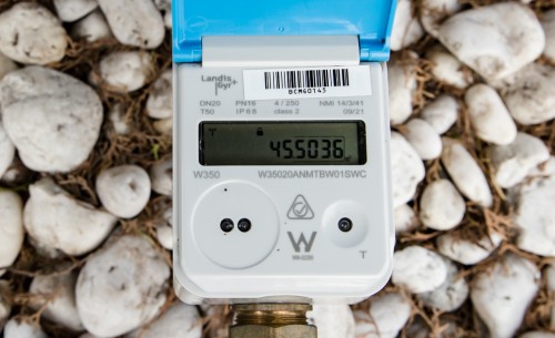 A close-up of a Landis+Gyr smart meter displaying the reading.