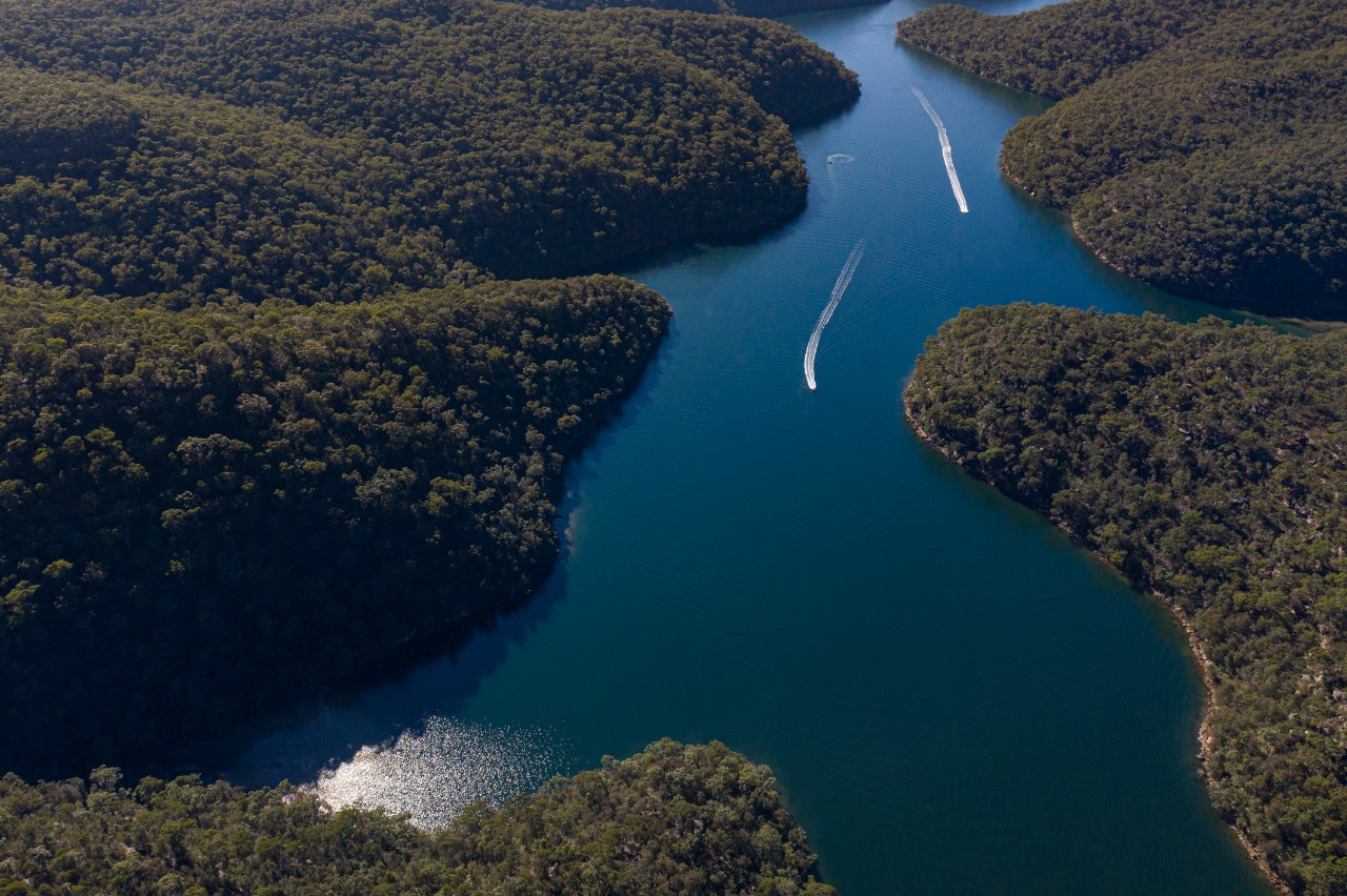 Aerial view of waterway surrounded by bushland - Cowan Creek, Sydney.